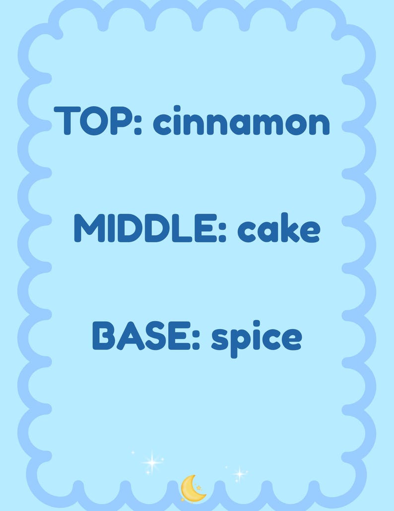 May include: A light blue card with a scalloped border. The text reads "TOP: cinnamon", "MIDDLE: cake", and "BASE: spice" in dark blue. A crescent moon and stars are at the bottom.