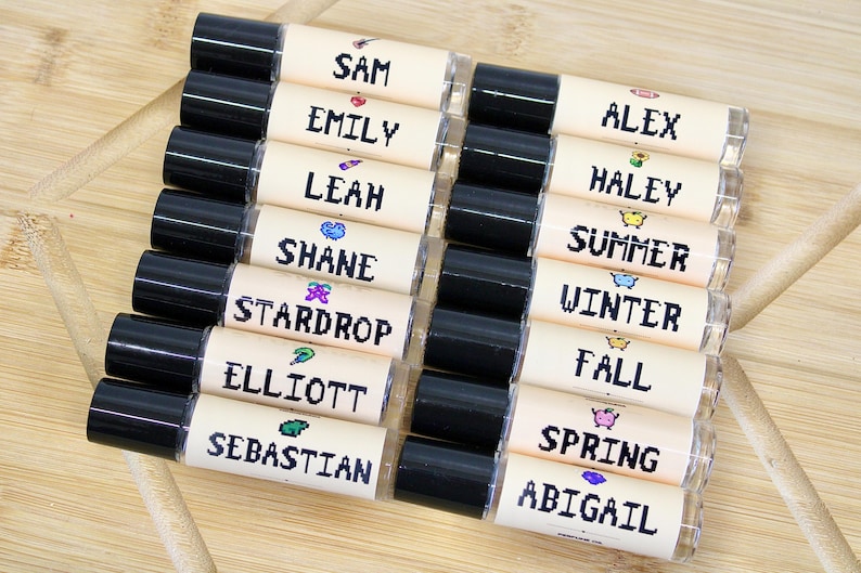 Pixel art Stardew Valley inspired perfume oil roll on featuring Elliott Shane Winter Summer Fall and Stardrop scents