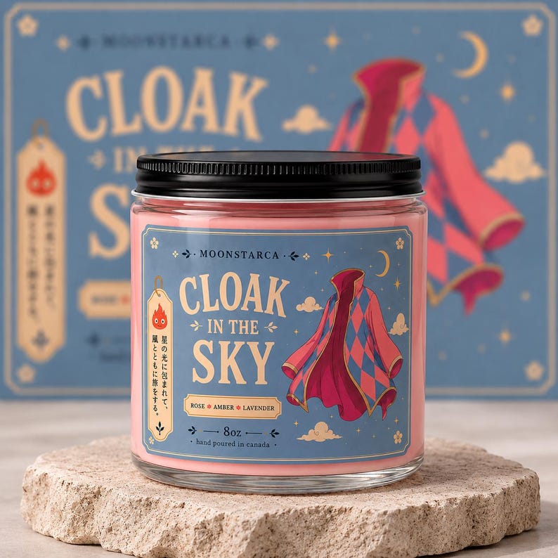 Fantasy inspired soy candle with floating cloak illustration and pink wax