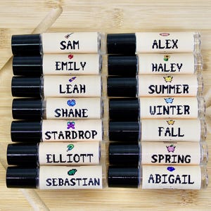 Stardew Valley inspired perfume oil with pixel art character labels including Elliott Shane Summer Winter Fall and Stardrop scents