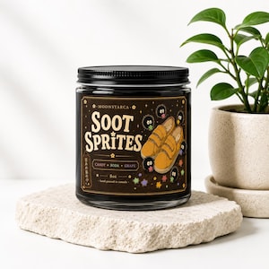 Soot Sprites soy candle with cute black sprite artwork and brown label