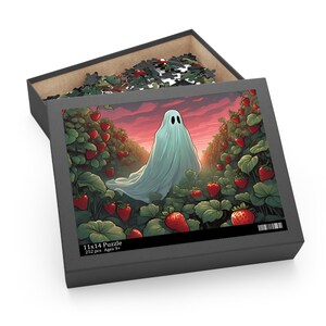 May include: A 252-piece jigsaw puzzle featuring a white ghost standing in a field of red strawberries. The box is black with the text "11x14 Puzzle 252 pcs Ages 9+"