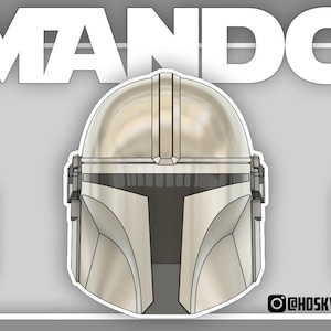 May include: A digital illustration of a Mandalorian helmet in silver, with detailed design. The word "MANDO" is displayed in large white letters above the helmet. The helmet is set against a grey background. The Instagram handle @HOSKWS is visible.