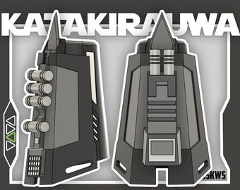 May include: Two 3D renderings of a futuristic device. The device is primarily gray and black, with cylindrical and rectangular components. The text "KATAKIRAUWA" is at the top. One view shows a side profile with cylindrical elements, and the other shows a front view.