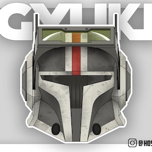 May include: A black, white, and gray helmet with a red stripe down the center. The helmet has a visor and a small antenna on top. The helmet is a popular character from the Star Wars universe.