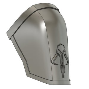May include: A gray 3D printed Mandalorian symbol, also known as the "Cuy'ar", is a symbol of the Mandalorian culture. The symbol is a stylized representation of a mythosaur skull.