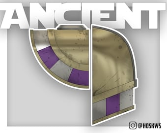 May include: A gold and purple helmet with a weathered, distressed look. The helmet is split into two sections, with a purple band around the top section. The helmet has a circular design on the top section.