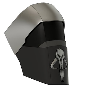 May include: A 3D printed helmet with a silver top and a black lower section. The lower section features a silver Mandalorian symbol.