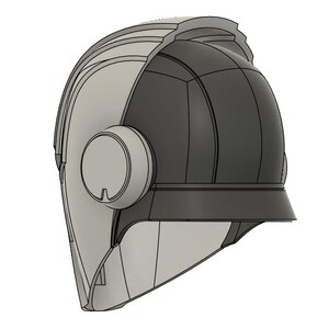 Op de afbeelding: Een tweekleurig helmontwerp, met een lichtgrijze voorkant en een donkergrijze achterkant. De helm heeft een cirkelvormig zij-element en een vizierachtige rand. Het ontwerp is futuristisch en strak, met een focus op geometrische vormen.