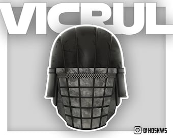 May include: A black and gray helmet with a metal grate over the face. The helmet has a textured surface and a white border. The text "VICRUL" is written in white letters at the top of the image.
