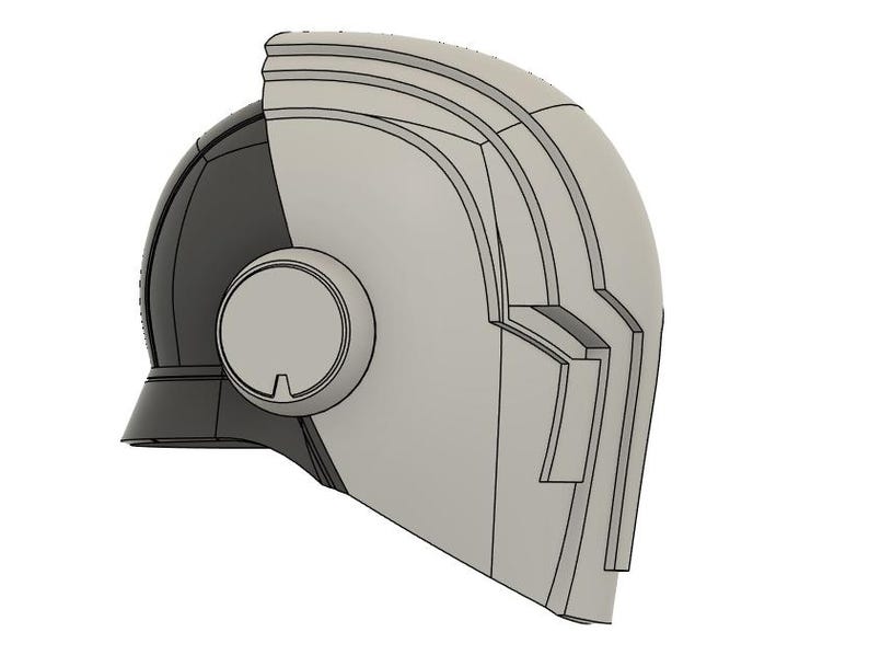 Op de afbeelding: Een tweekleurig helmontwerp, met een donkergrijze sectie aan de linkerkant en een lichtgrijze sectie aan de rechterkant. De helm heeft een cirkelvormig element aan de zijkant en hoekige details, wat wijst op een futuristisch of sciencefiction thema.