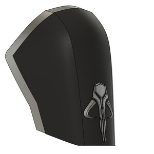 May include: Black and gray 3D printed Mandalorian symbol, a stylized helmet with horns and a vertical line, on a black background.