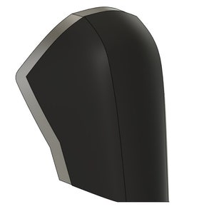 May include: A black and silver 3D printed model of a helmet. The helmet has a rounded shape and a smooth surface.