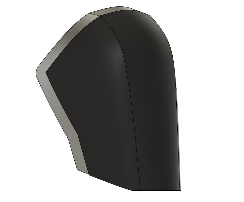 May include: A black and silver 3D printed model of a helmet. The helmet has a rounded shape and a smooth surface.