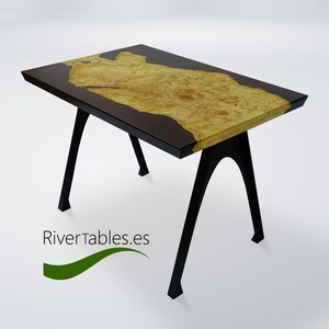 May include: A small, modern table with a black and yellow epoxy resin top and black metal legs. The table is on a white background.