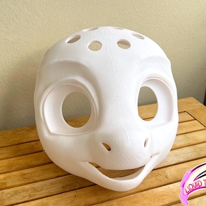 May include: A white, 3D-printed mask with large eye openings, a smiling mouth, and a series of small holes on top. The mask has a smooth, rounded design, and is likely for cosplay or costume use.