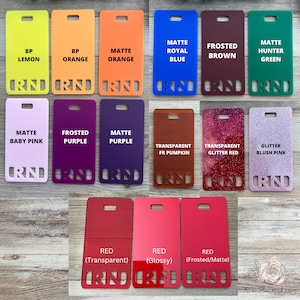 May include: A collection of 12 acrylic sheets in various colors and finishes, including matte, frosted, transparent, and glitter. The sheets are labeled with their color and finish, such as "Matte Orange", "Frosted Purple", and "Glitter Blush Pink".