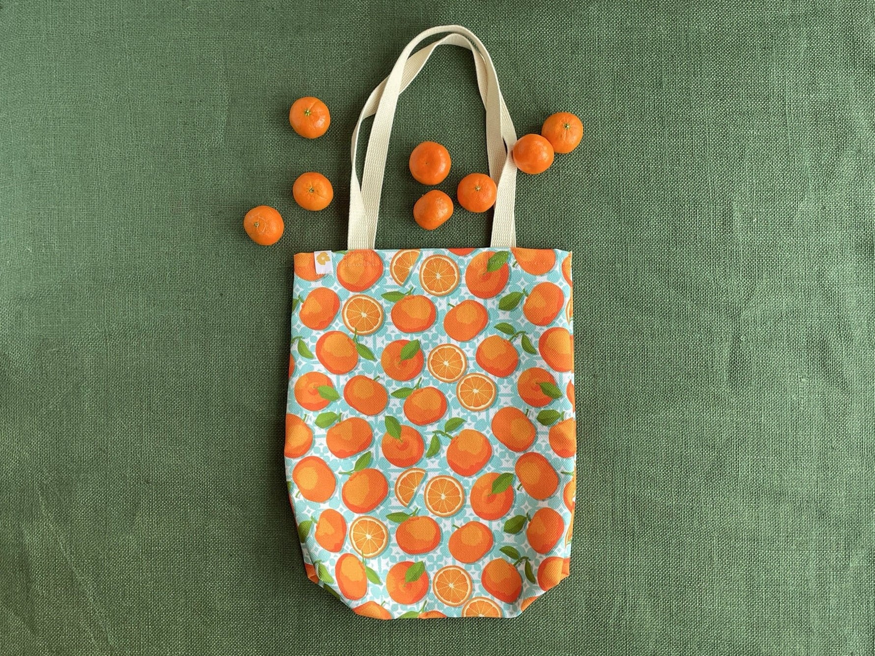 Tangerine canvas totebag - bright oranges on turquoise market tote bag