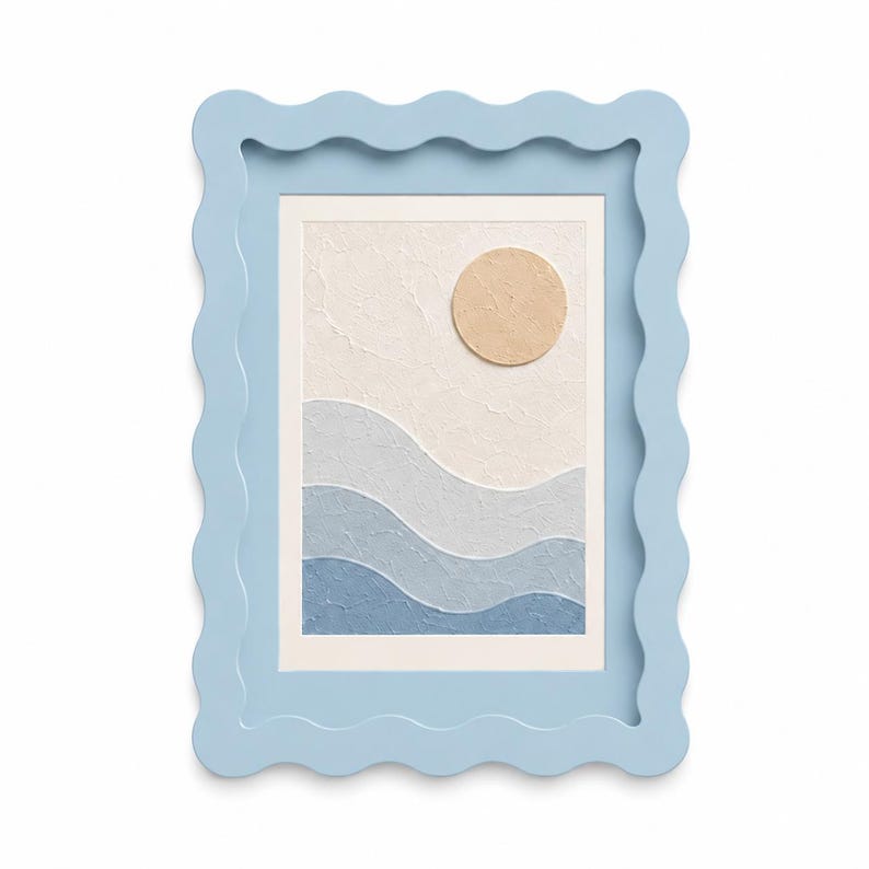 May include: A rectangular wall art piece featuring a textured abstract landscape with a beige circular sun above layered wavy bands of light blue, medium blue, and dark blue, all encased in a light blue frame with a scalloped, wavy edge.