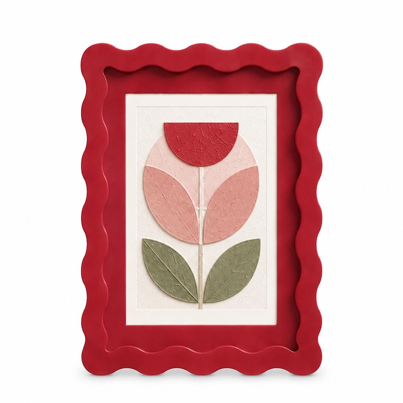 May include: A rectangular wall art piece featuring a red wavy frame surrounding a textured white background. The central artwork displays a stylized flower composed of a red semi-circle, two pink oval petals, and two green leaves.