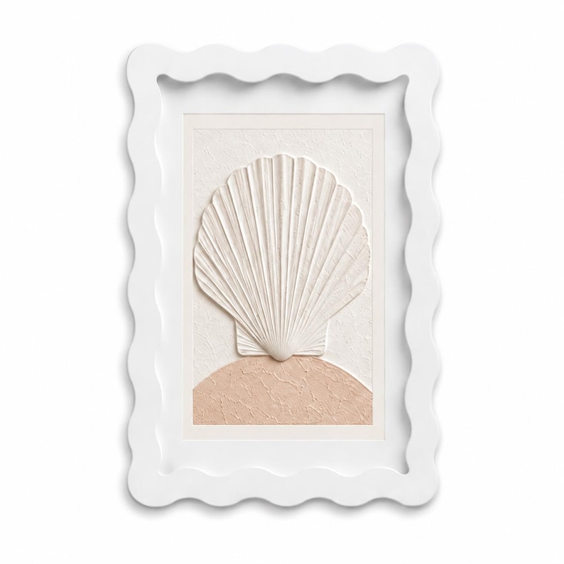 May include: A rectangular wall art piece featuring a white scalloped frame. The center displays a raised, textured white seashell relief positioned above a semi-circular, textured light peach-colored base on a cream-colored background.