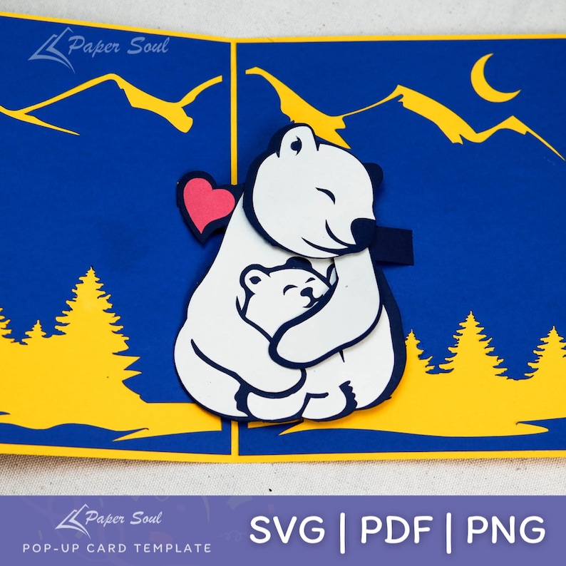 May include: A pop-up card template featuring a white polar bear hugging a smaller polar bear with a pink heart in the background. The card is set against a blue background with yellow mountains and trees. The text "SVG | PDF | PNG" is at the bottom of the card.