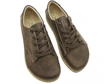 May include: A pair of brown leather lace-up shoes with a rounded toe.