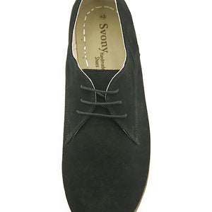 May include: Black suede lace-up shoes with a brown sole. The shoes have a white label inside that reads "SvonY Handmade Shoes".