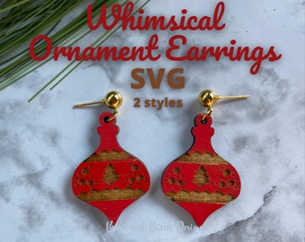 May include: Red and gold Whimsical Ornament Earrings with gold-colored posts and ball accents. The earrings are in the shape of Christmas ornaments with a tree design. The text "Whimsical Ornament Earrings SVG 2 styles" is visible.
