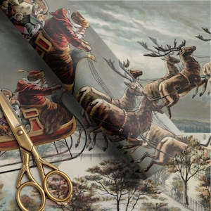May include: A roll of wrapping paper featuring a vintage illustration of Santa Claus in a red coat driving a sleigh pulled by reindeer over a snowy landscape, accompanied by a pair of ornate gold-colored metal scissors with decorative handles.