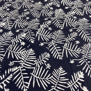 May include: Black fabric with a white repeating pattern of stylized fern leaves.