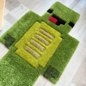 Handgemaakt groen Pixel Hero-tapijt – Op maat gemaakt pluizig cartoontapijt voor kinderkamer, gamerdecor, vloermat in pixelstijl