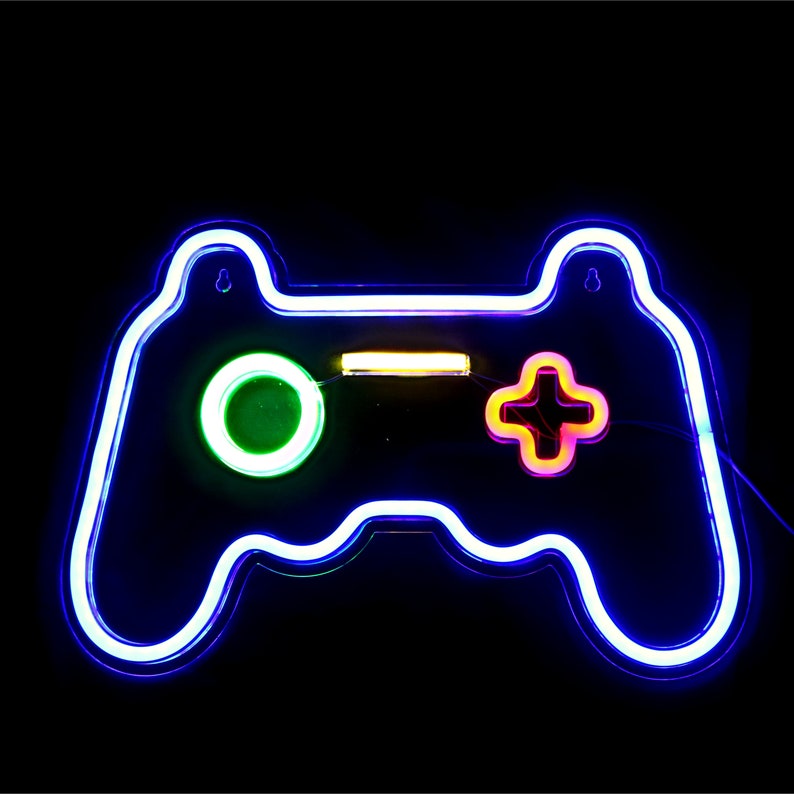 May include: A neon blue video game controller sign with a green circle button and a pink plus button.