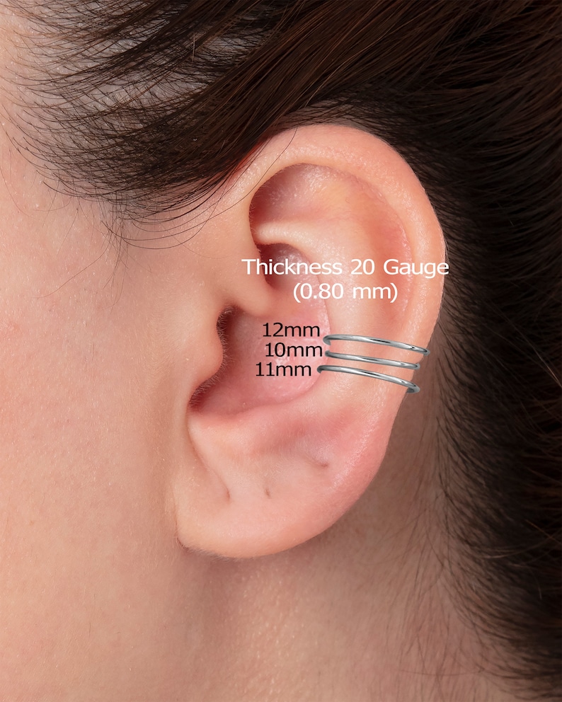 May include: Three silver ear cuffs in different sizes. The ear cuffs are 12mm, 10mm, and 11mm in diameter. The text on the image reads: 'Thickness 20 Gauge (0.80 mm)'
