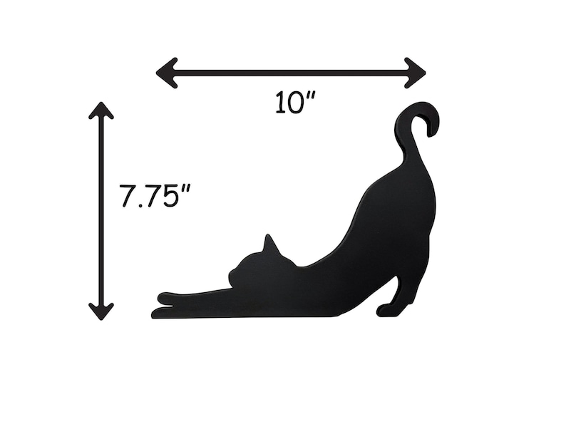 Black wood cat silhouette wall decor. The cat is stretched out with its tail curled up. The silhouette is 10 inches wide and 7.75 inches tall.