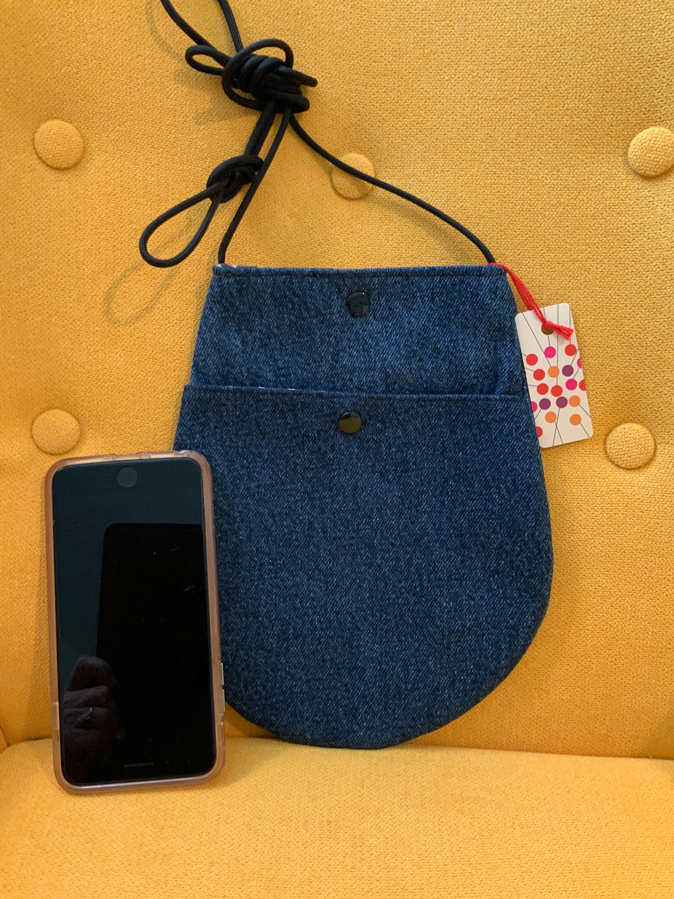 This blue denim teardrop crossbody bag from reclaimed fabrics. Etsy