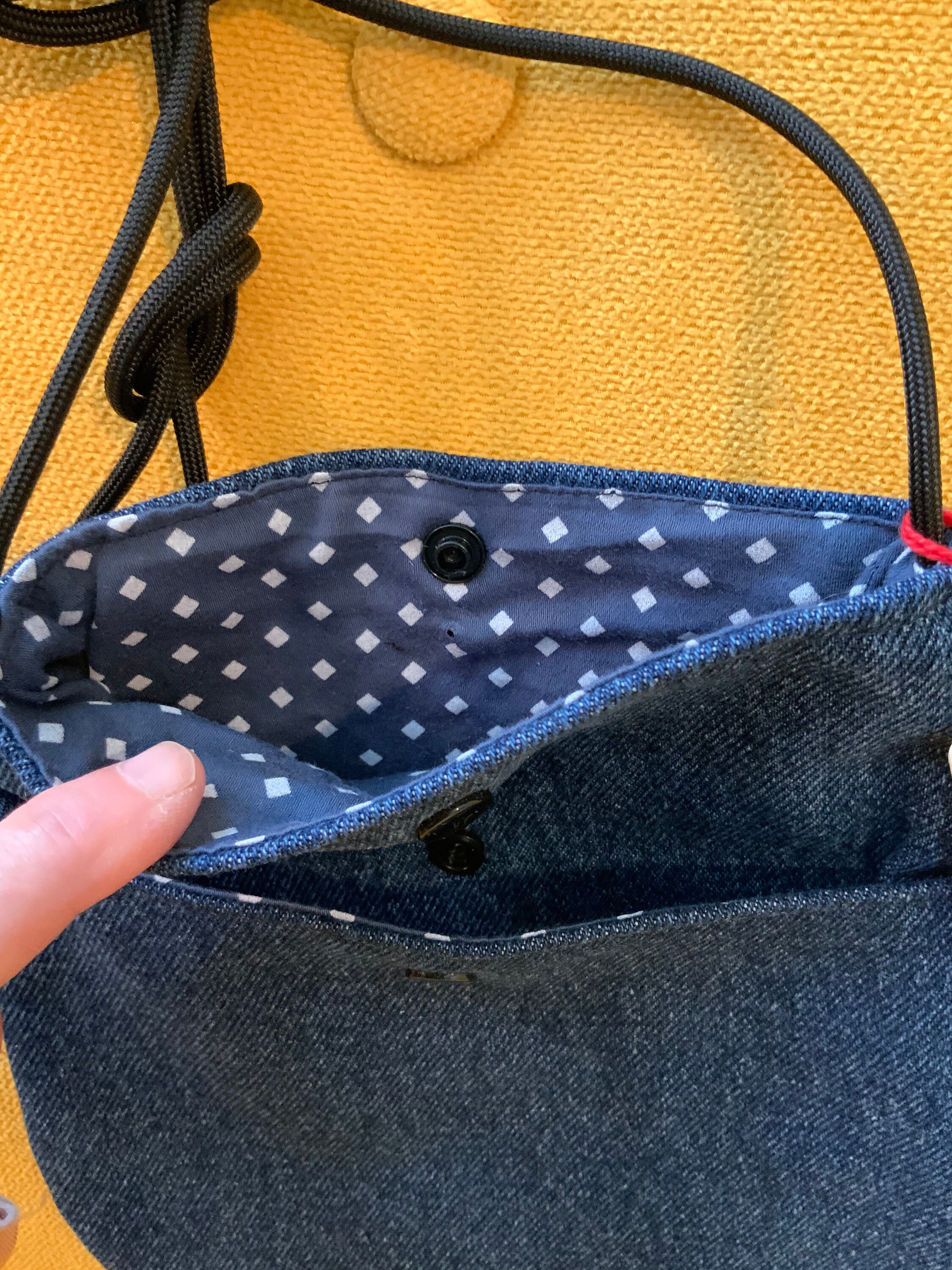 This blue denim teardrop crossbody bag from reclaimed fabrics. Etsy