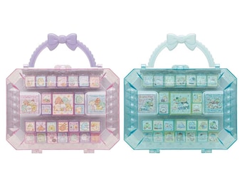 May include: Two plastic storage cases with a handle and a bow on top. The cases are filled with small colorful stamps. One case is light blue and the other is light purple.