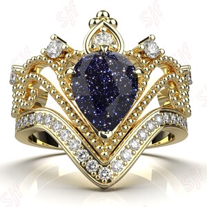 May include: A gold ring with a blue gemstone set in a crown-shaped design. The ring is adorned with smaller diamonds around the gemstone and band.