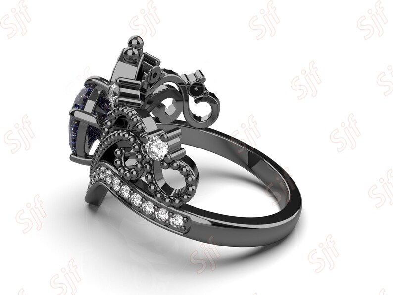 May include: Black ring with a large blue gemstone and smaller white gemstones set in a detailed, ornate design.