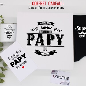 May include: A gift set for a grandfather with a white mug, a card, a white canvas tote bag, and black socks. The mug, card, and tote bag all have the text "Papy" and a mustache design. The socks have the text "Super Papy" and a mustache design.