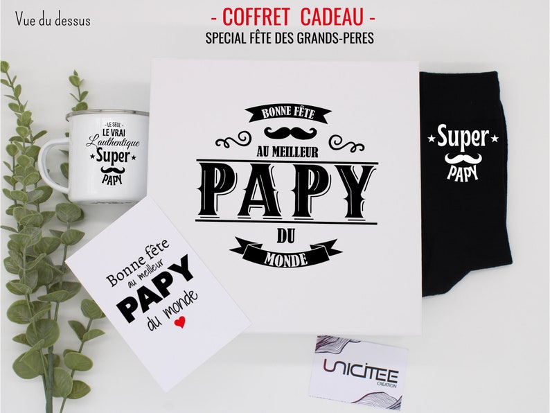 May include: A gift set for a grandfather with a white mug, a card, a white canvas tote bag, and black socks. The mug, card, and tote bag all have the text "Papy" and a mustache design. The socks have the text "Super Papy" and a mustache design.