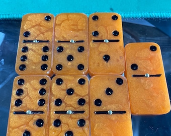 orange and black dominos—double 6/9/12 are available