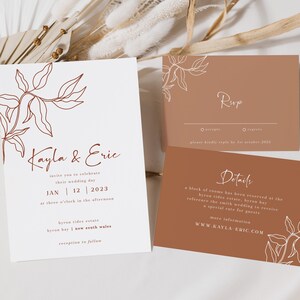 May include: A white wedding invitation with a brown floral design and the text "Kayla & Eric" and "Jan 12 2023". A brown RSVP card with the text "RSVP" and "Details" and a white floral design.