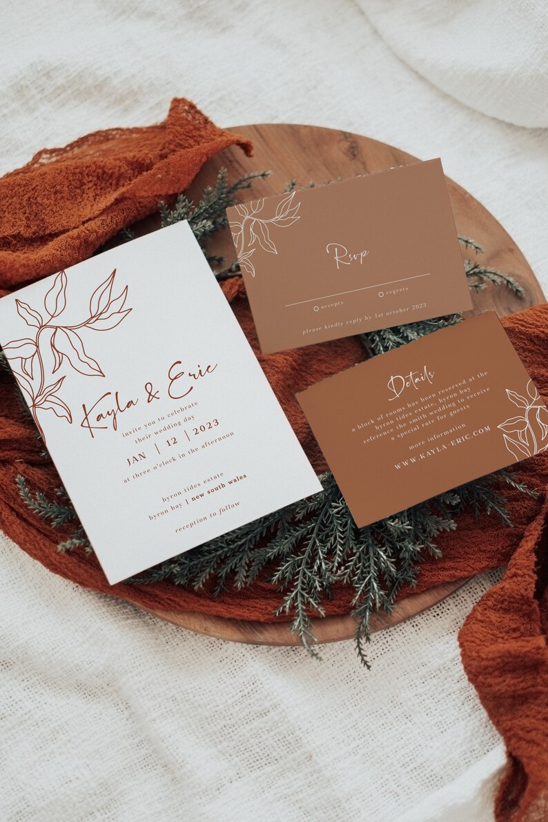 May include: Wedding invitation suite with a minimalist design featuring a brown and white color scheme. The invitation card has a hand-drawn floral illustration and the text "Kayla & Eric" in a script font. The RSVP card has a simple design with the text "RSVP" in a script font. The details card has the text "Details" in a script font and includes information about the wedding venue and accommodations.