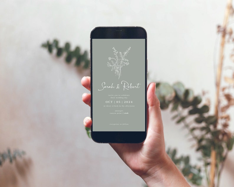May include: A smartphone displaying a wedding invitation with a light green background and white floral illustration. The invitation reads "Sarah & Robert" and includes the date "OCT | 05 | 2024".