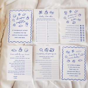 May include: A set of six baby shower game cards with blue text and illustrations on a white background. The cards include games like "Diaper Raffle," "Baby Item ABC," and "Guess Who Mommy or Daddy?" The cards are decorated with a blue scalloped border.