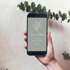May include: A smartphone displaying a wedding invitation with a floral design and the text "Sarah & Robert" and "OCT 05 | 2024".