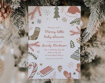 May include: A Christmas-themed baby shower invitation. The card features festive illustrations of snowflakes, mittens, and a stocking. The text reads "Merry little baby shower" and includes event details.