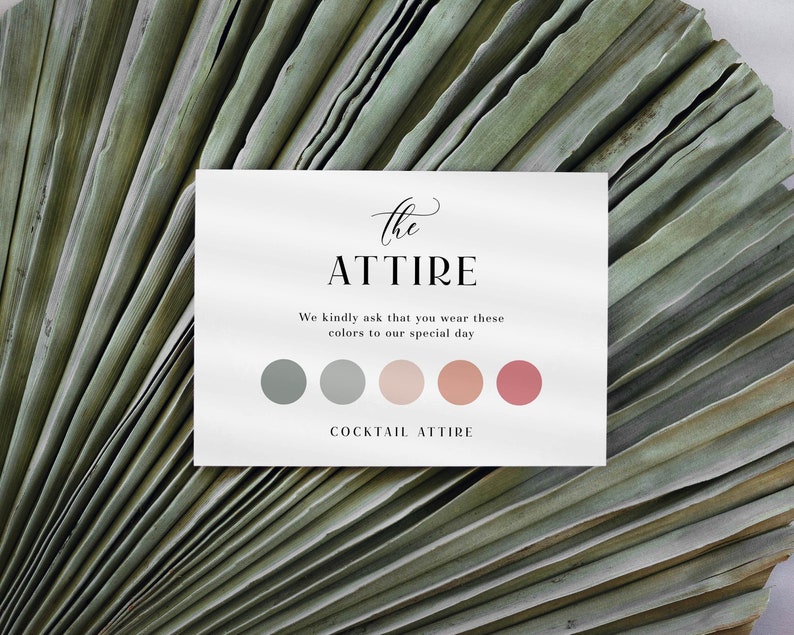 May include: A white card with the text "the ATTIRE" in black script font. The text "We kindly ask that you wear these colors to our special day" is below the title. There are six color swatches in a row: two gray, two light pink, and two pink. The text "COCKTAIL ATTIRE" is below the color swatches.